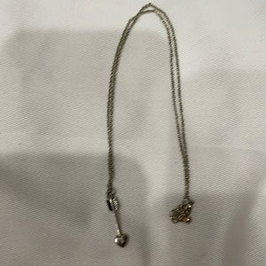 Gold arrow necklace.